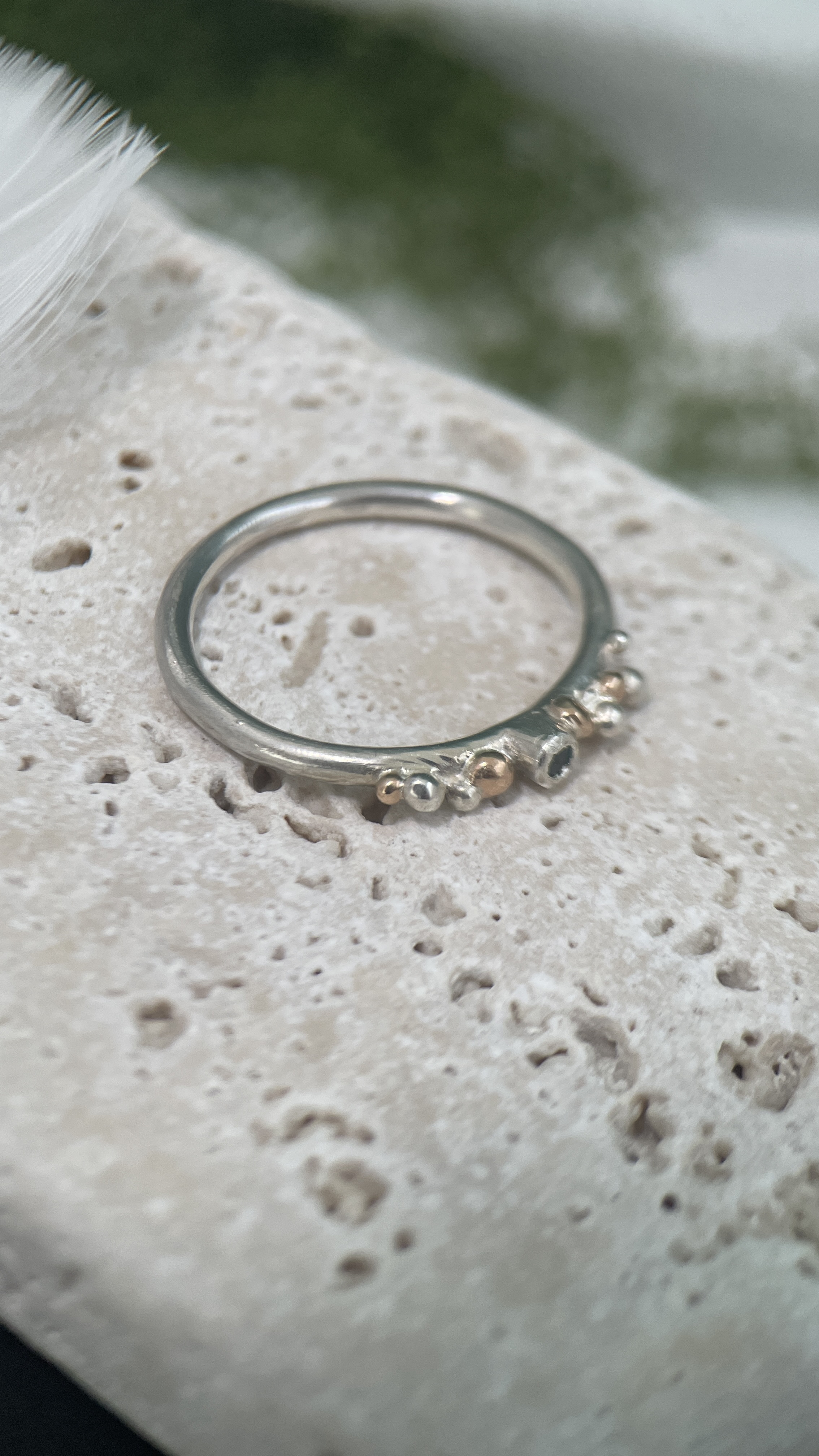 Ring with granulated decor and ice blue topaz